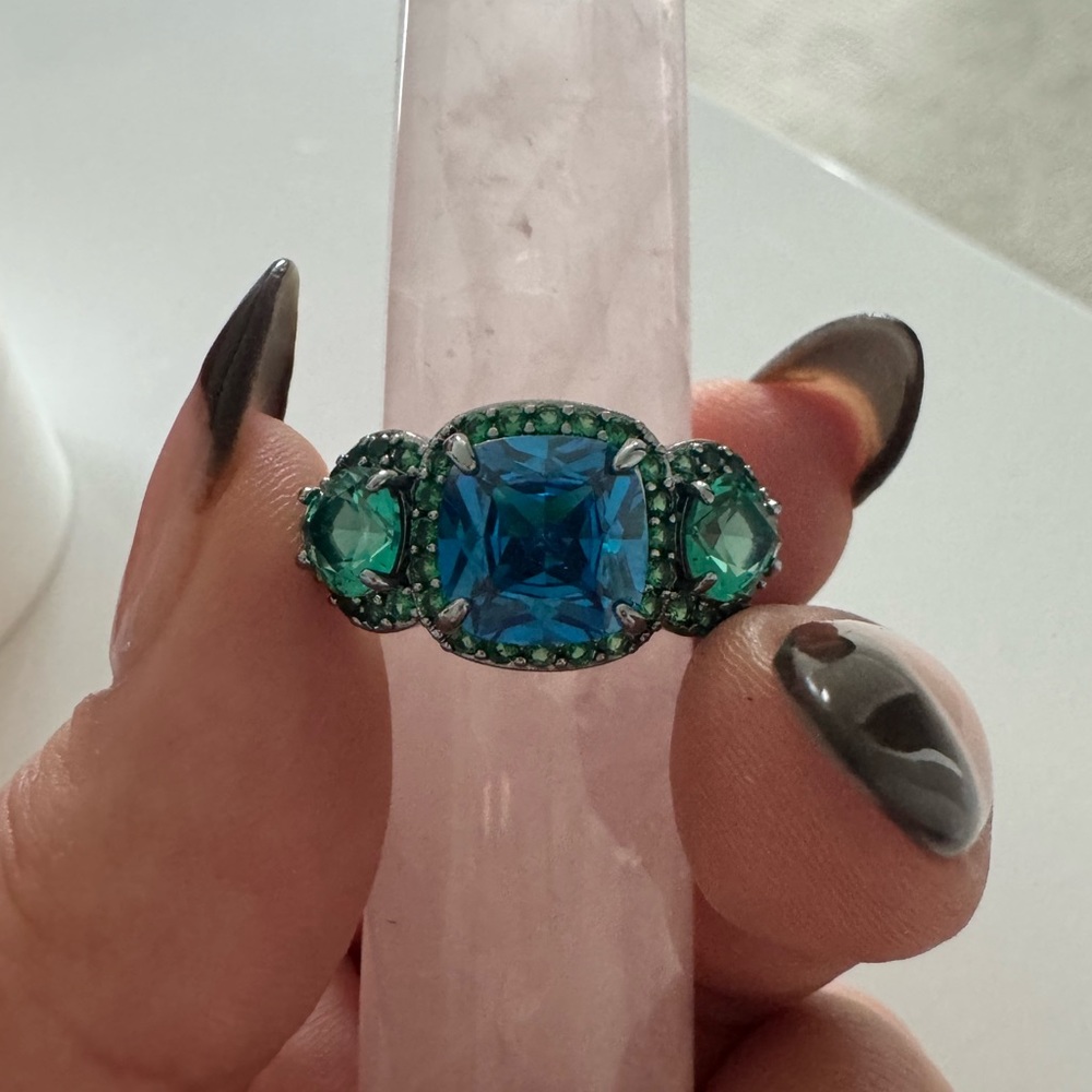 Paraiba Tourmaline and Blue Topaz on hematite band.